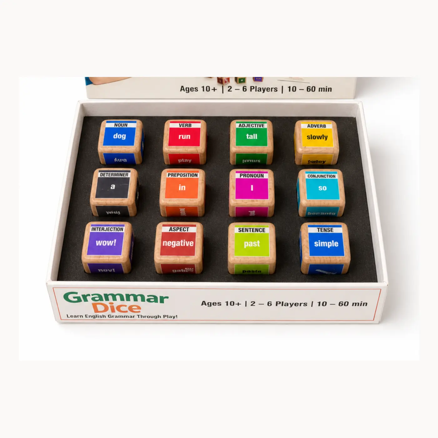 Clean close-up of 12 colour-coded wooden grammar dice